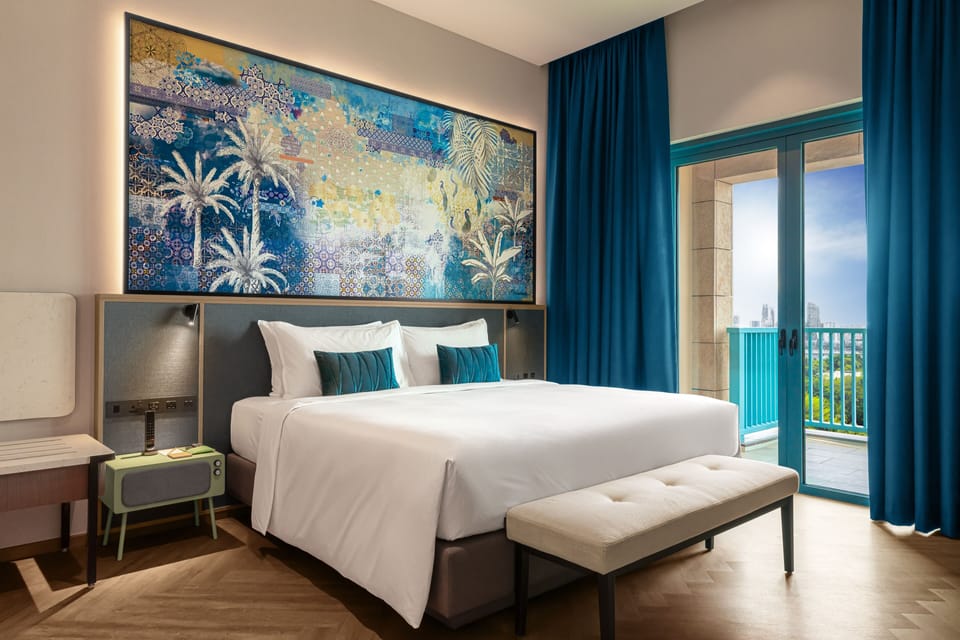 Deluxe Suite | Minibar (free items), in-room safe, desk, iron/ironing board
