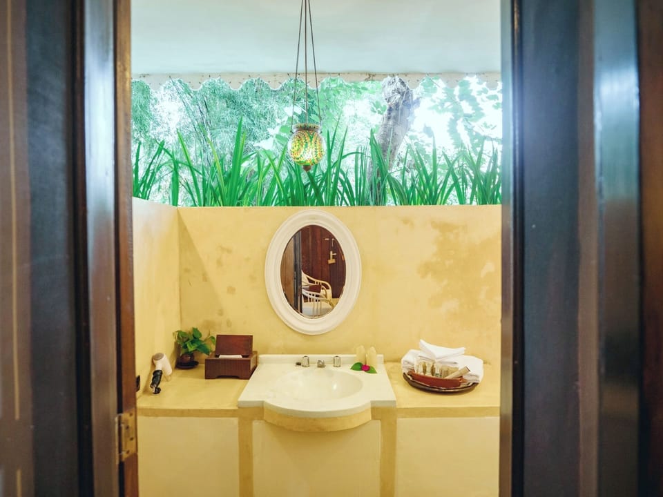 TUGU SUITE | Bathroom | Free toiletries, slippers, bidet, towels