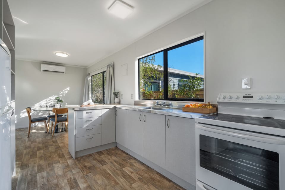 Park Motel (2BR) | Private kitchen | Shared fridge, microwave