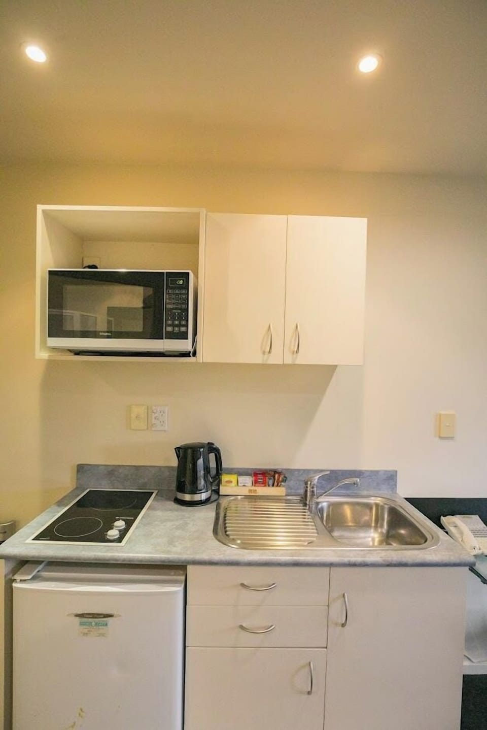 Fridge, microwave, stovetop, coffee/tea maker