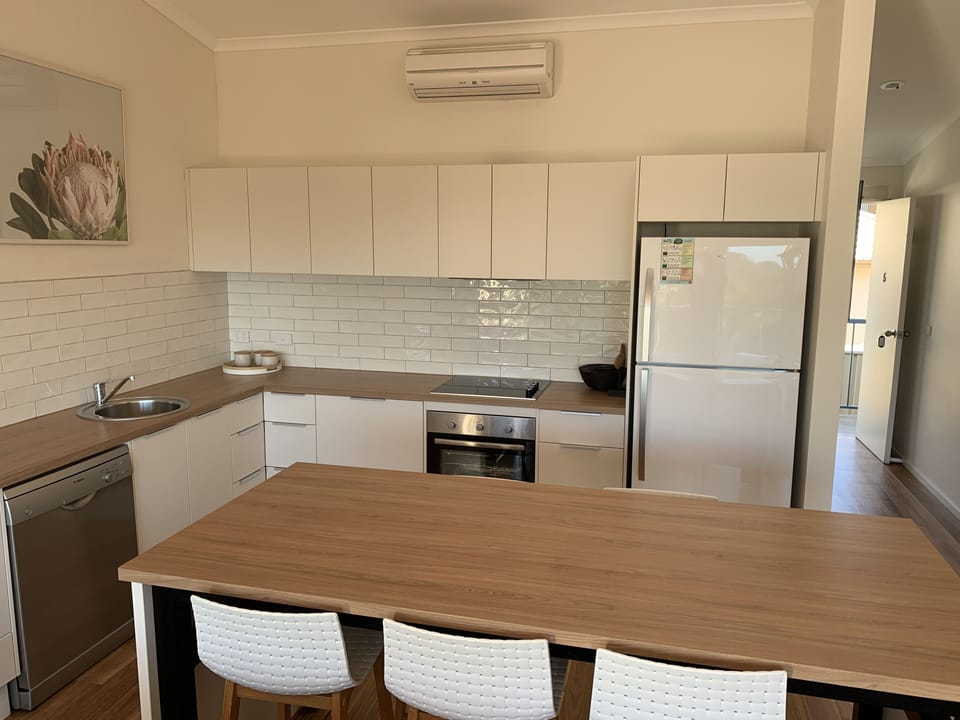 Apartment 5: Upstairs - 2 Bedrooms | Private kitchen | Fridge, microwave, oven, stovetop