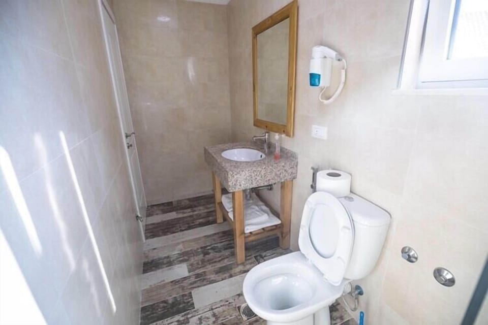 Double Room with Balcony, 204 | Bathroom | Shower, free toiletries, hair dryer, slippers