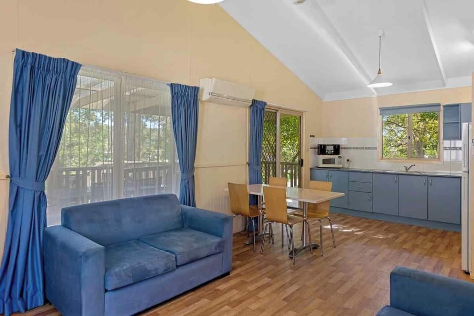 Superior 2 Bedroom Access Cabin | Living area | Flat-screen TV