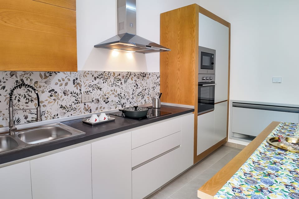 Family Apartment (LA DUCHESSA) | Private kitchen | Electric kettle, dining tables