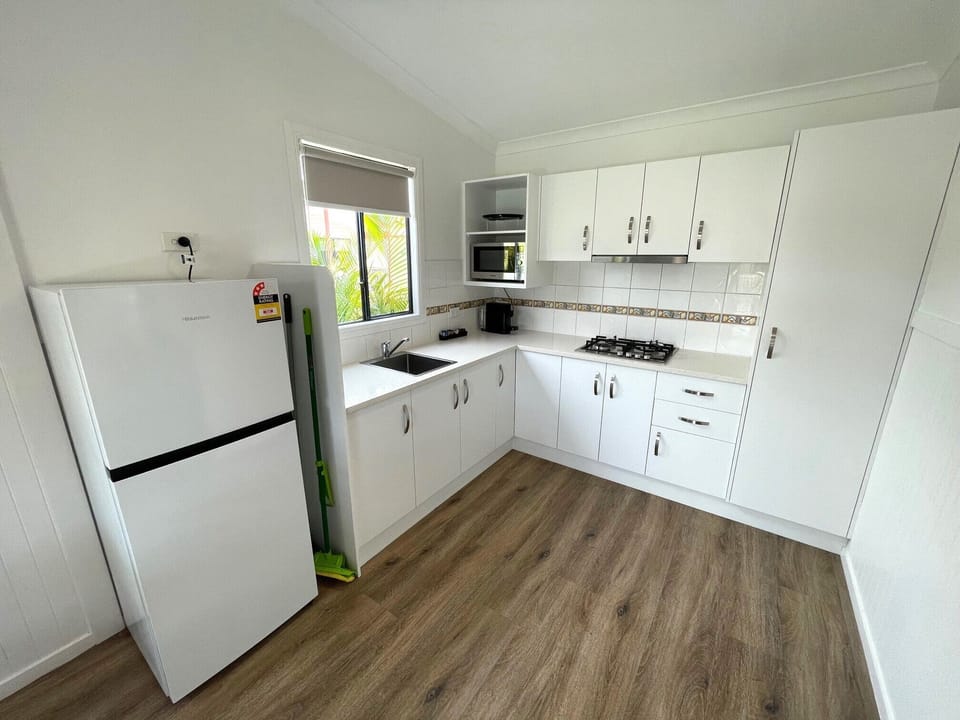 Deluxe Villa, 2 Bedrooms | Private kitchen | Coffee/tea maker, electric kettle, dining table