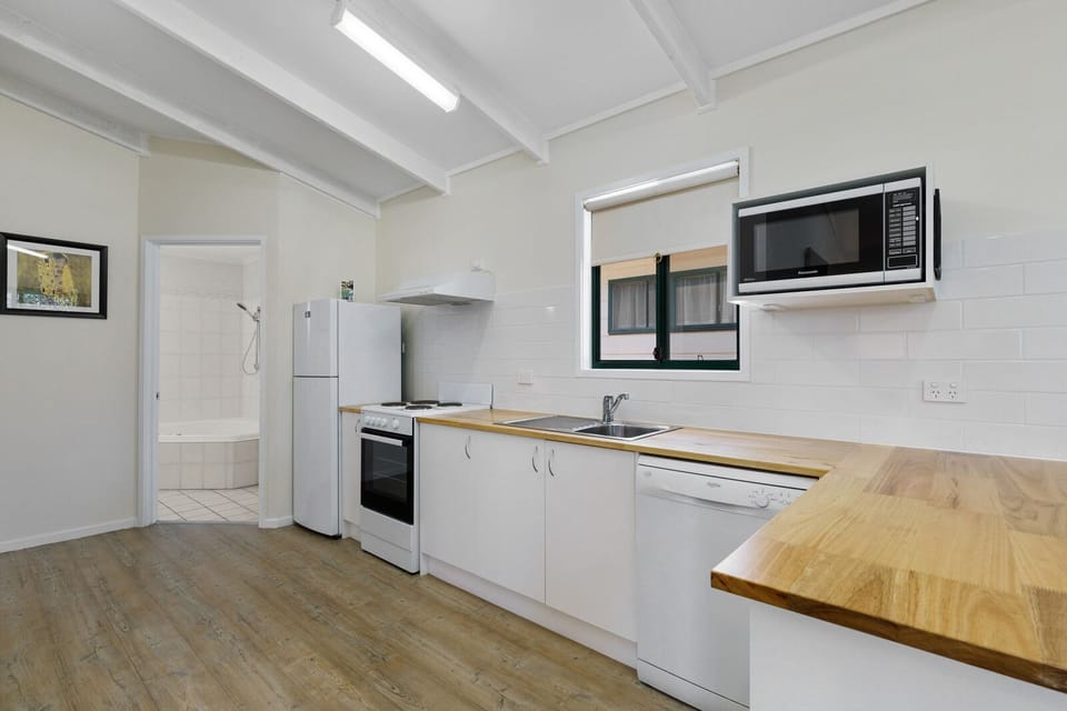 Full-size fridge, microwave, stovetop, electric kettle