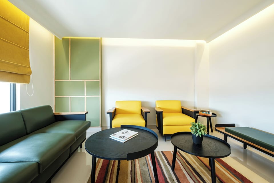 Urban Suite | Living area | 43-inch LCD TV with cable channels, books