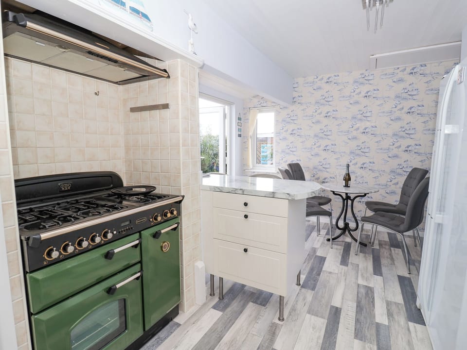 Fridge, electric kettle, toaster, cookware/dishes/utensils
