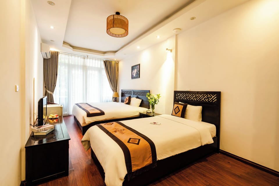 Family Suite | Minibar, in-room safe, blackout drapes, free WiFi
