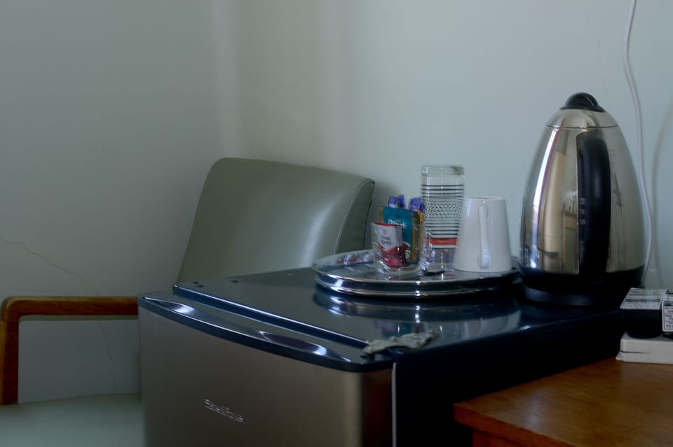 Standard Suite, 1 Bedroom, Non Smoking, Shared Bathroom (Single suite) | Desk, iron/ironing board, free WiFi, bed sheets