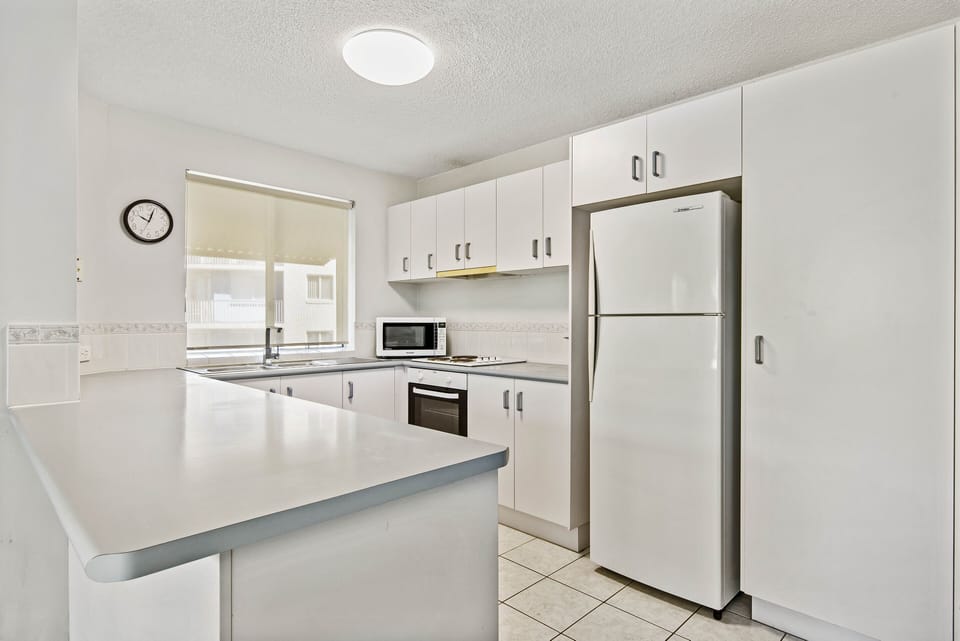 Family Apartment, 2 Bedrooms, Beachside | Private kitchen | Coffee/tea maker, full-size fridge, microwave, oven