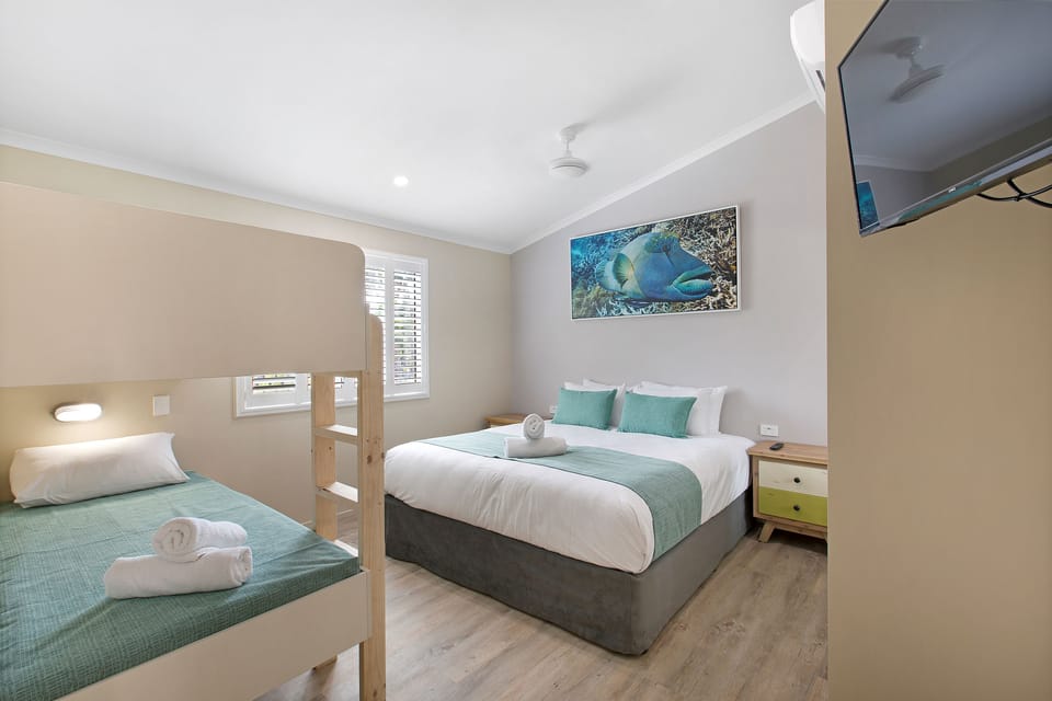 Deluxe Cottage, 2 Bedrooms, Garden Area | Blackout drapes, iron/ironing board, free cribs/infant beds, free WiFi