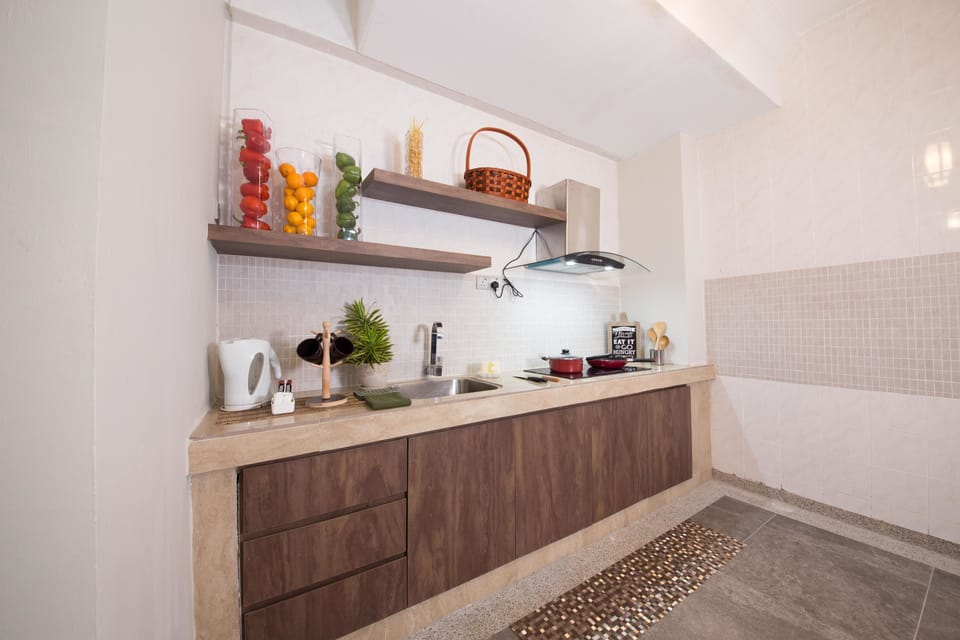 One Bedroom Deluxe Apartment | Private kitchen | Full-size fridge, coffee/tea maker, cookware/dishes/utensils