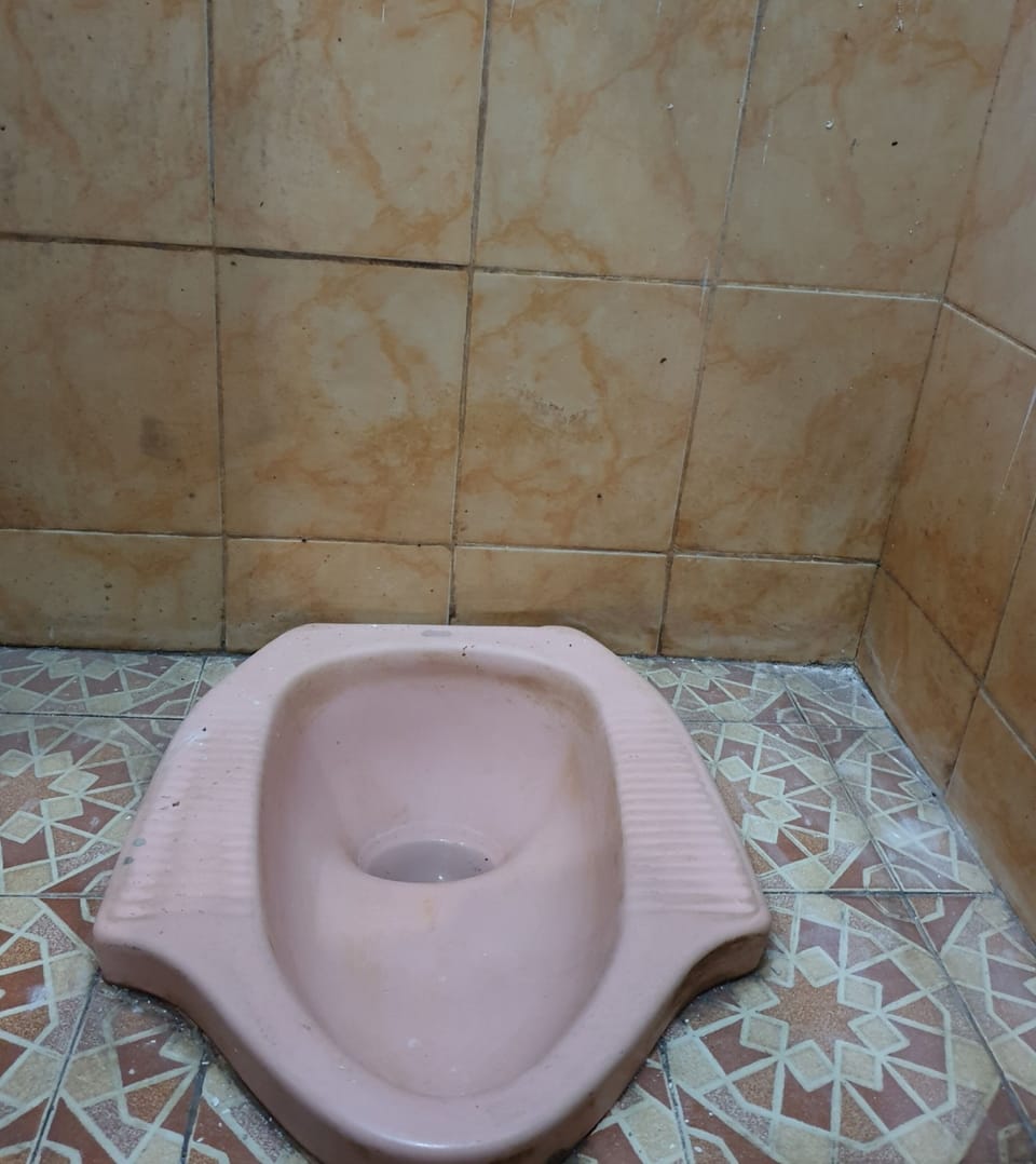 Economy Double Room | Bathroom | Shower, towels, toilet paper