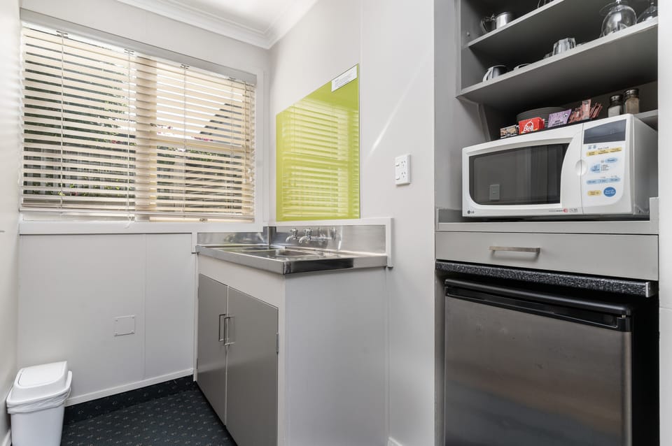 Mini-fridge, microwave, electric kettle, toaster