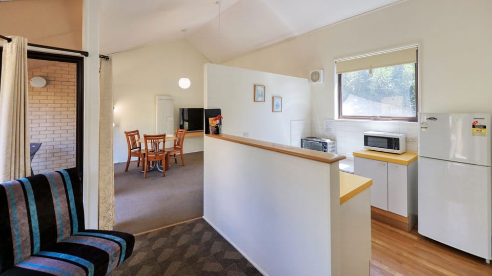 One Bedroom Apartment | Living area | 55-inch Smart TV with digital channels, TV