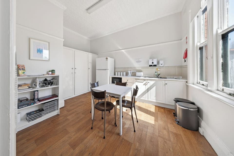 Full-size fridge, shared microwave