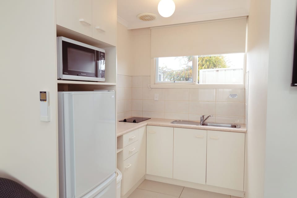 Family Apartment | Private kitchen | Microwave, coffee/tea maker, toaster, highchair