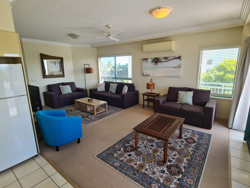 Family Apartment, 3 Bedrooms, Beachside | Living area | 32-inch flat-screen TV with digital channels, TV, table tennis