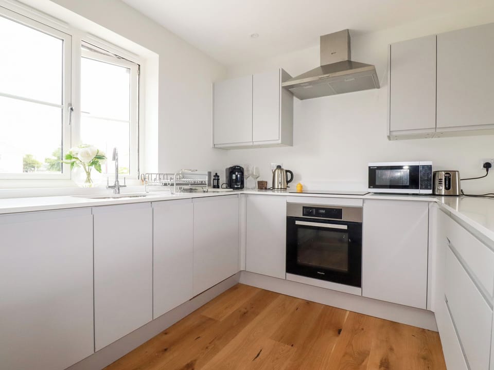 Fridge, dishwasher, electric kettle, cookware/dishes/utensils