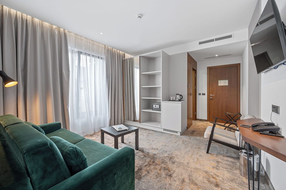 Deluxe Suite, 2 Bedrooms | In-room safe, desk, laptop workspace, soundproofing