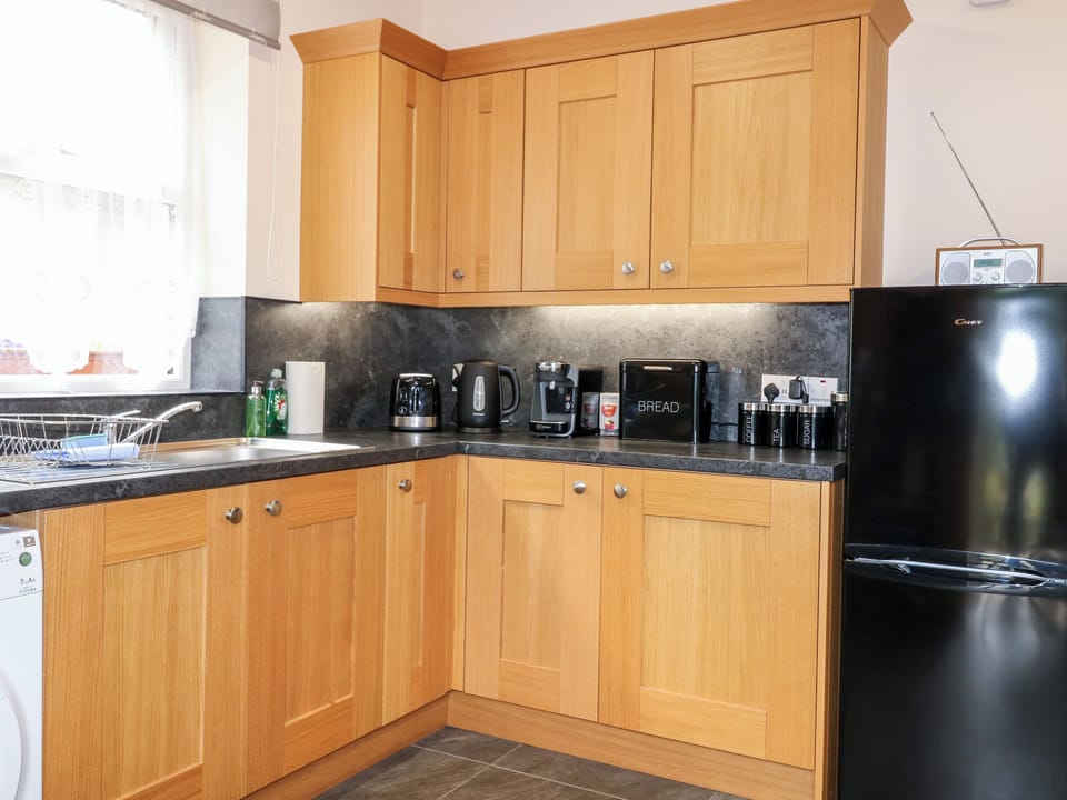 Fridge, electric kettle, toaster, cookware/dishes/utensils