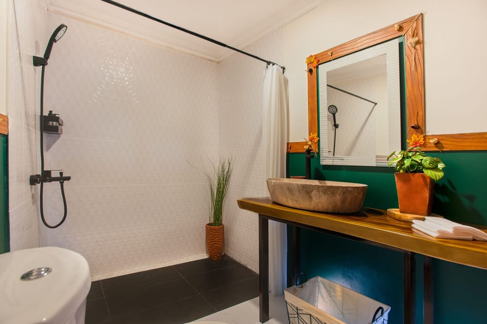 Family Cottage, 2 Bedrooms, Mezzanine | Bathroom | Shower, rainfall showerhead, free toiletries, slippers