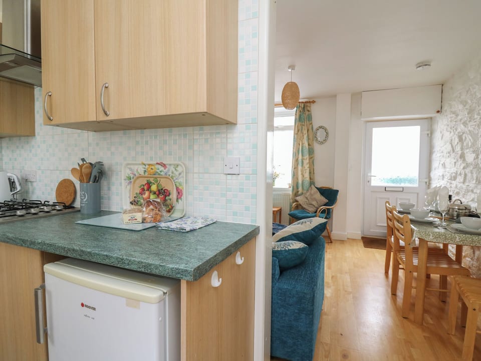 Fridge, electric kettle, toaster, cookware/dishes/utensils