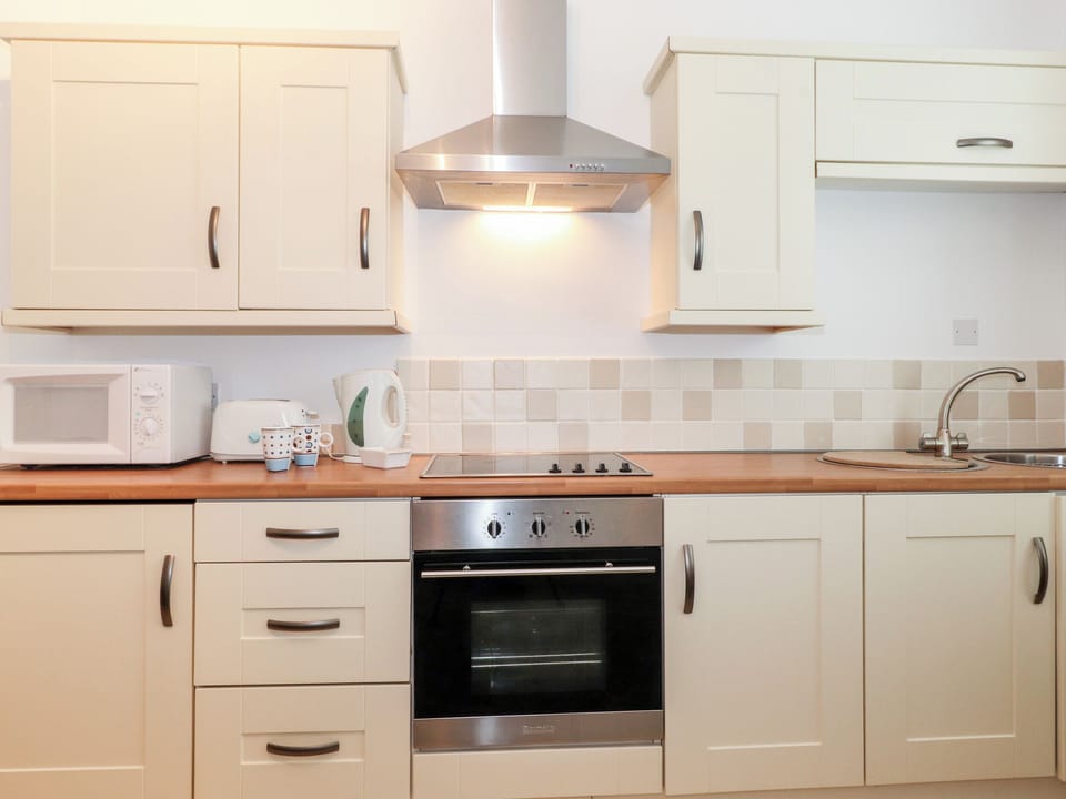 Fridge, electric kettle, toaster, cookware/dishes/utensils