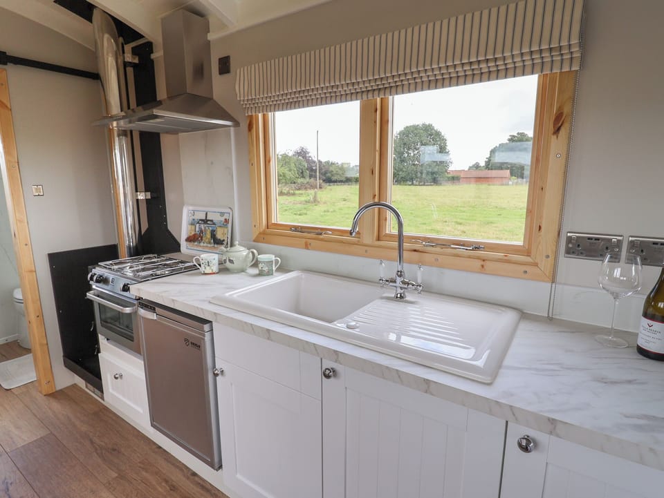 Fridge, electric kettle, cookware/dishes/utensils