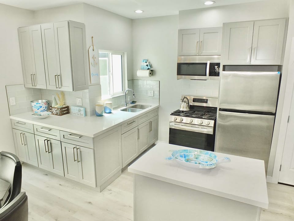 Condo, Multiple Beds, Kitchen (Beach & Bay Retreat) | Private kitchen | Coffee/tea maker, fridge, microwave, oven