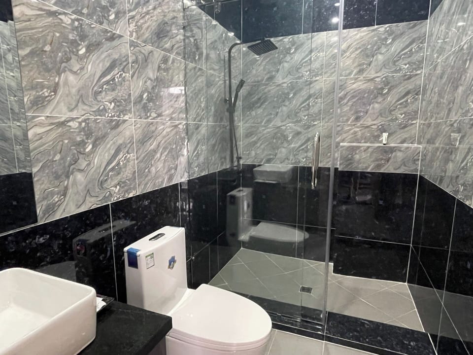 Shower, free toiletries, hair dryer, slippers