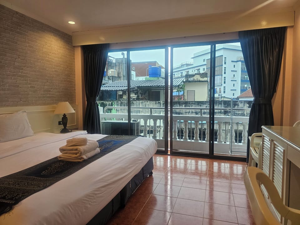 Deluxe Room with Balcony | In-room safe, desk, blackout drapes, free WiFi