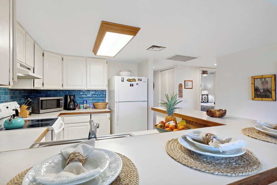 Condo, Multiple Beds, Balcony, Partial Ocean View (Plumeria Hale) | Private kitchen | Coffee/tea maker, fridge, microwave, oven