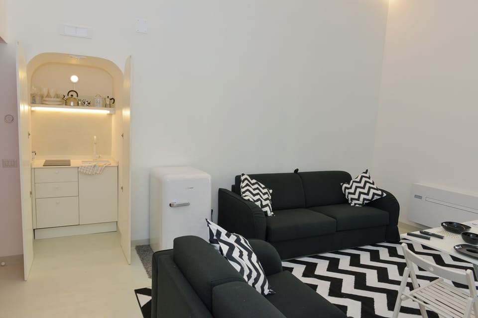 City Apartment | Living area | 65-inch Smart TV with digital channels
