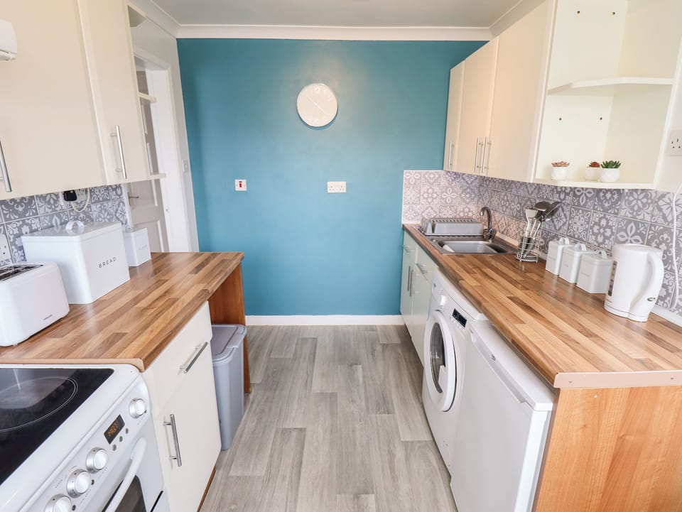 Fridge, electric kettle, toaster, cookware/dishes/utensils