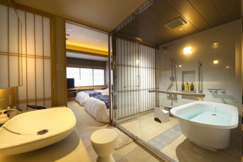 Free toiletries, hair dryer, slippers, electronic bidet