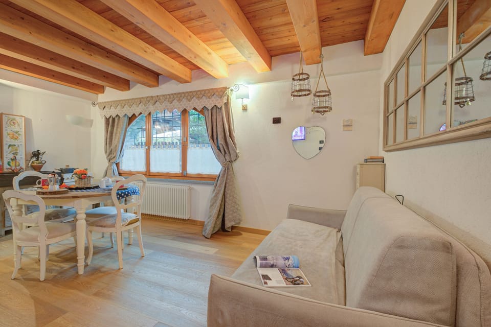 Family Studio (Cozy Nest In Bardonecchia) | Living area | 21-inch Smart TV with cable channels