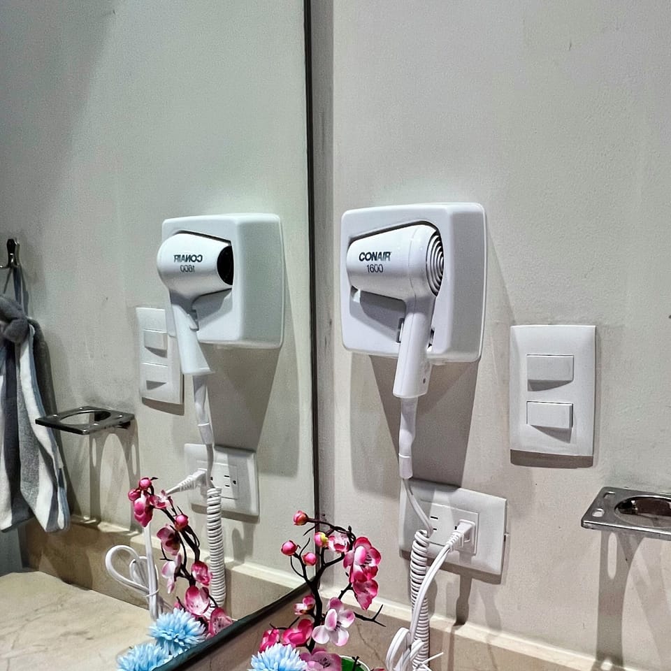 Shower, rainfall showerhead, hair dryer, towels