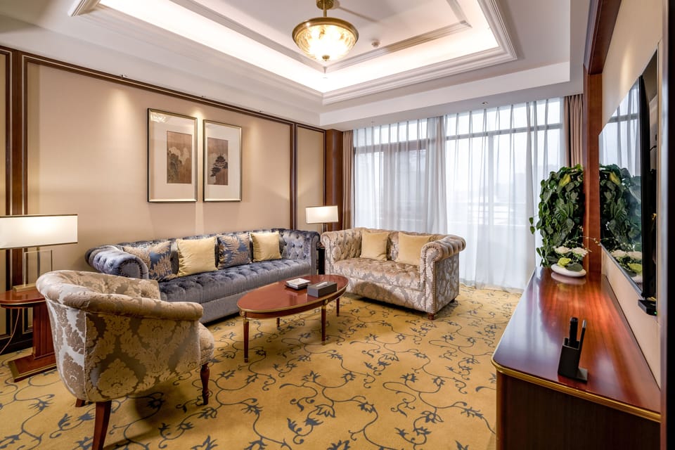 Standard Suite | Living room | 50-inch TV with cable channels