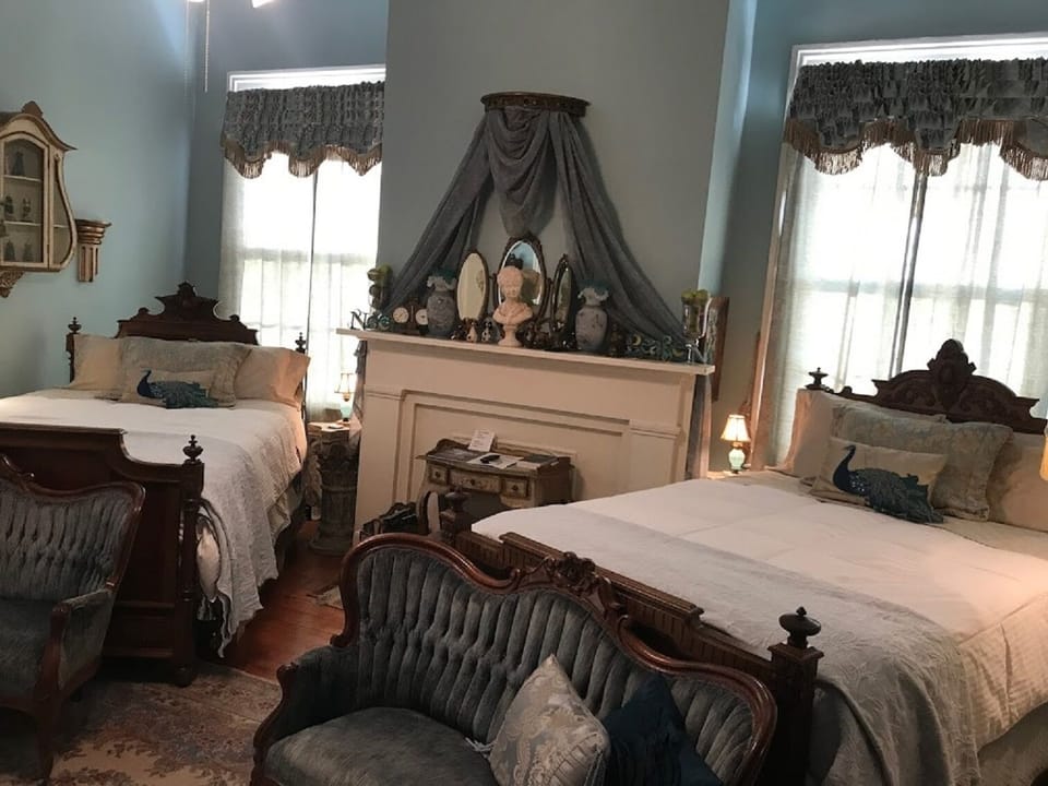 Suite, 2 Queen Beds (French Suite) | Living area | 42-inch Smart TV with cable channels, TV, fireplace