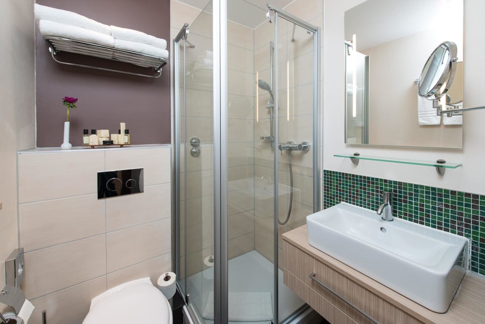 Combined shower/tub, free toiletries, hair dryer, bathrobes