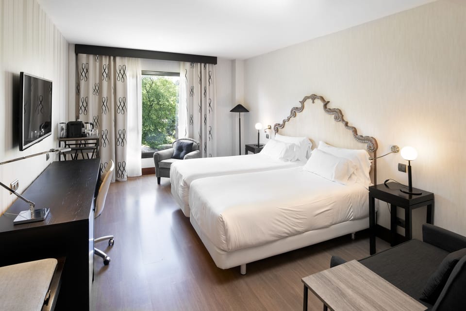Superior Room | Minibar, in-room safe, desk, blackout drapes