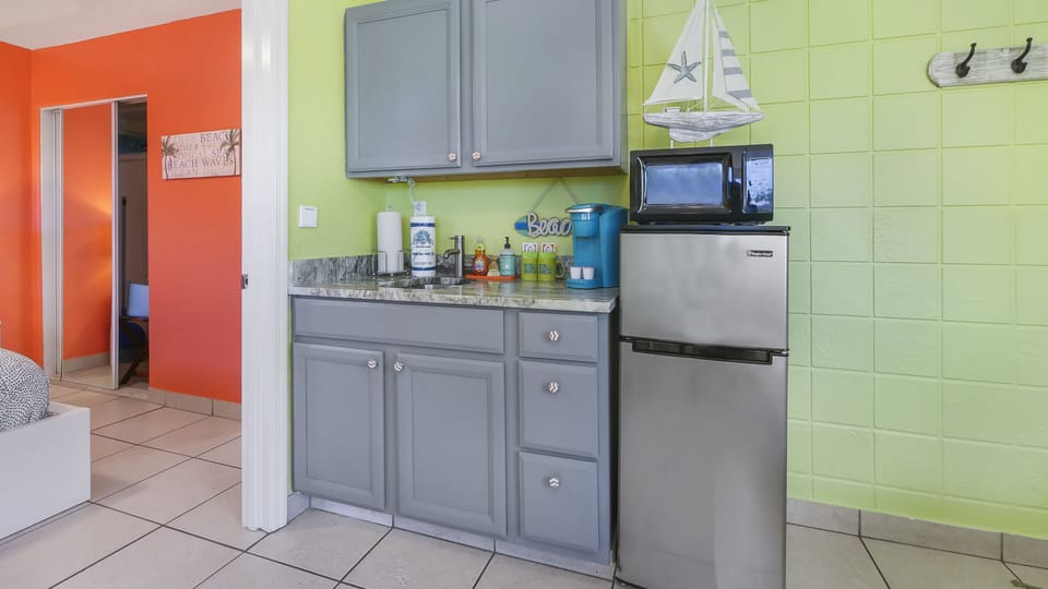 Fridge, microwave, stovetop, coffee/tea maker