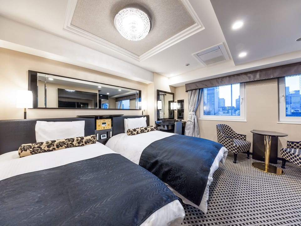 Deluxe Twin Room, Non Smoking | Down comforters, desk, blackout drapes, iron/ironing board