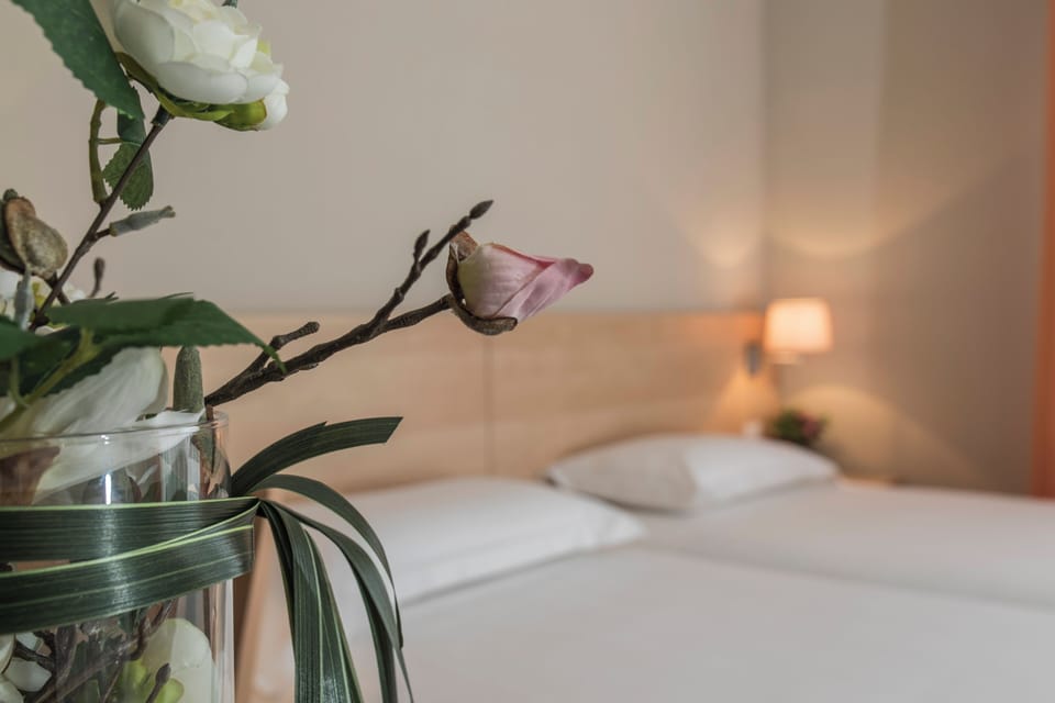 Premium bedding, down comforters, Tempur-Pedic beds, minibar