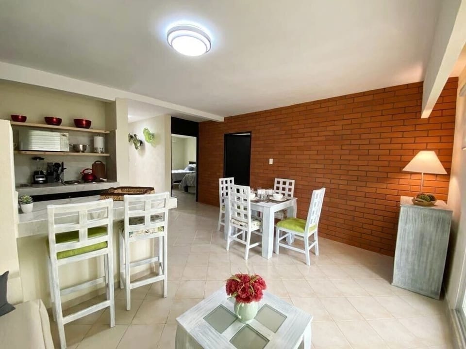 Two-Bedroom Apartment - Golf Course View | Living area | 65-inch flat-screen TV with cable channels