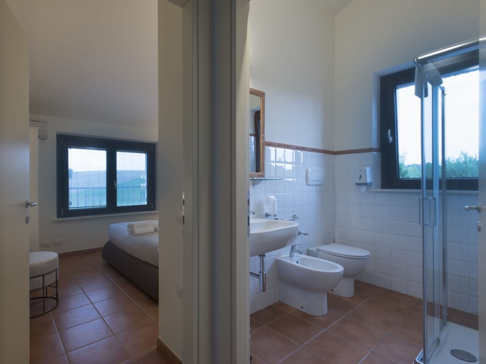 Comfort Quadruple Room (split level, 2 adults + 2 children ) | Minibar, iron/ironing board, rollaway beds