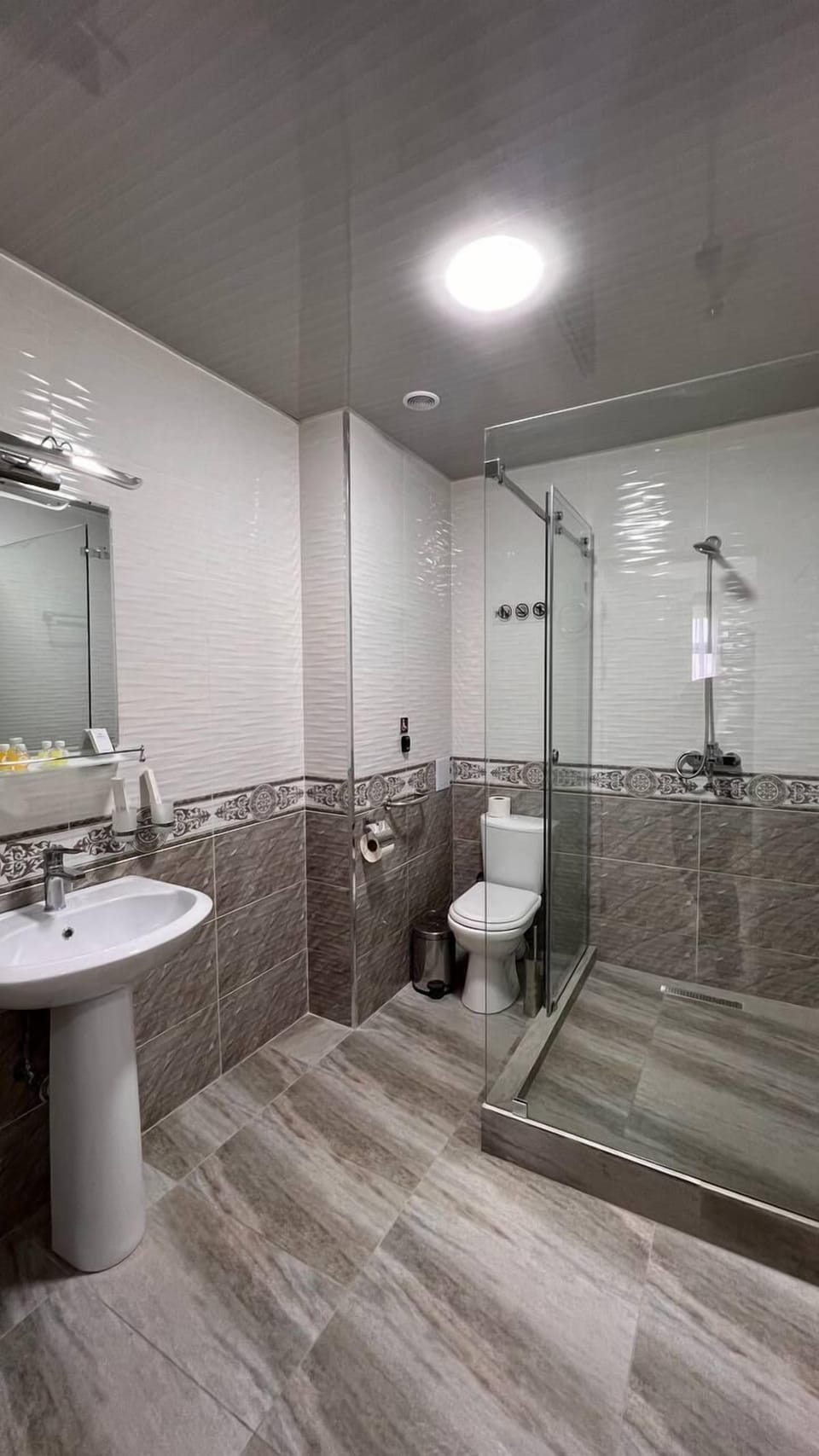 Shower, free toiletries, hair dryer, slippers