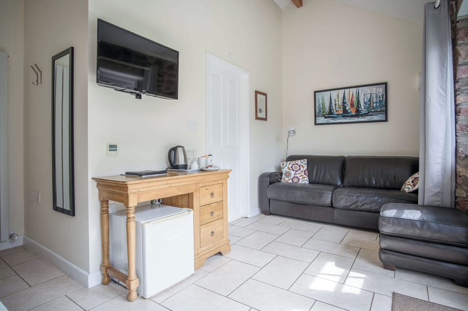 Apartment (1 Bedroom) | Living area | 32-inch Smart TV with cable channels
